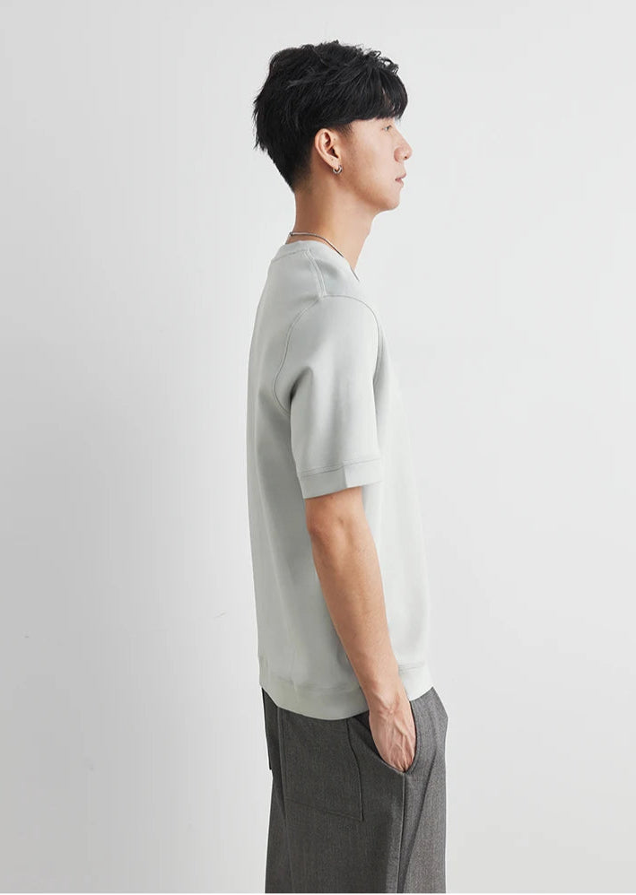 CIIVET - Model wearing a light grey sweater and dark pants on a white background