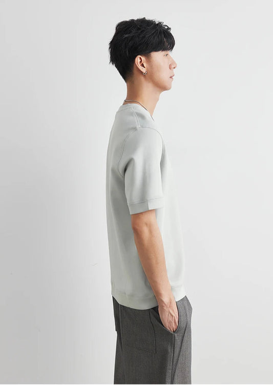 CIIVET - Model wearing a light grey sweater and dark pants on a white background