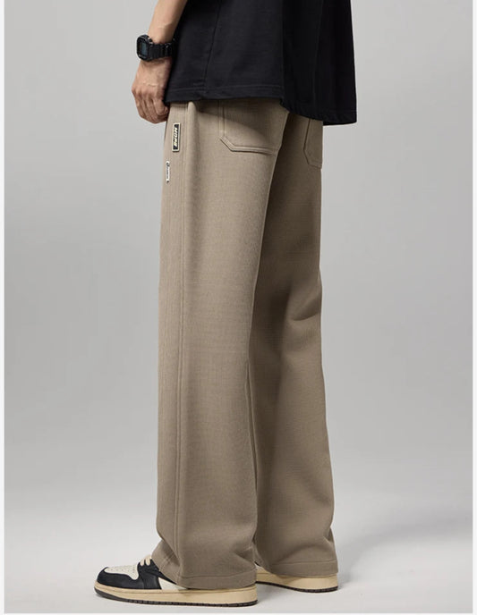 CIIVET Beige pants worn by a model on a plain background with 'Fashion New Men's Wear' text.