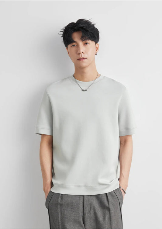 CIIVET - Model wearing a light grey O-neck sweater and grey pants against a white background